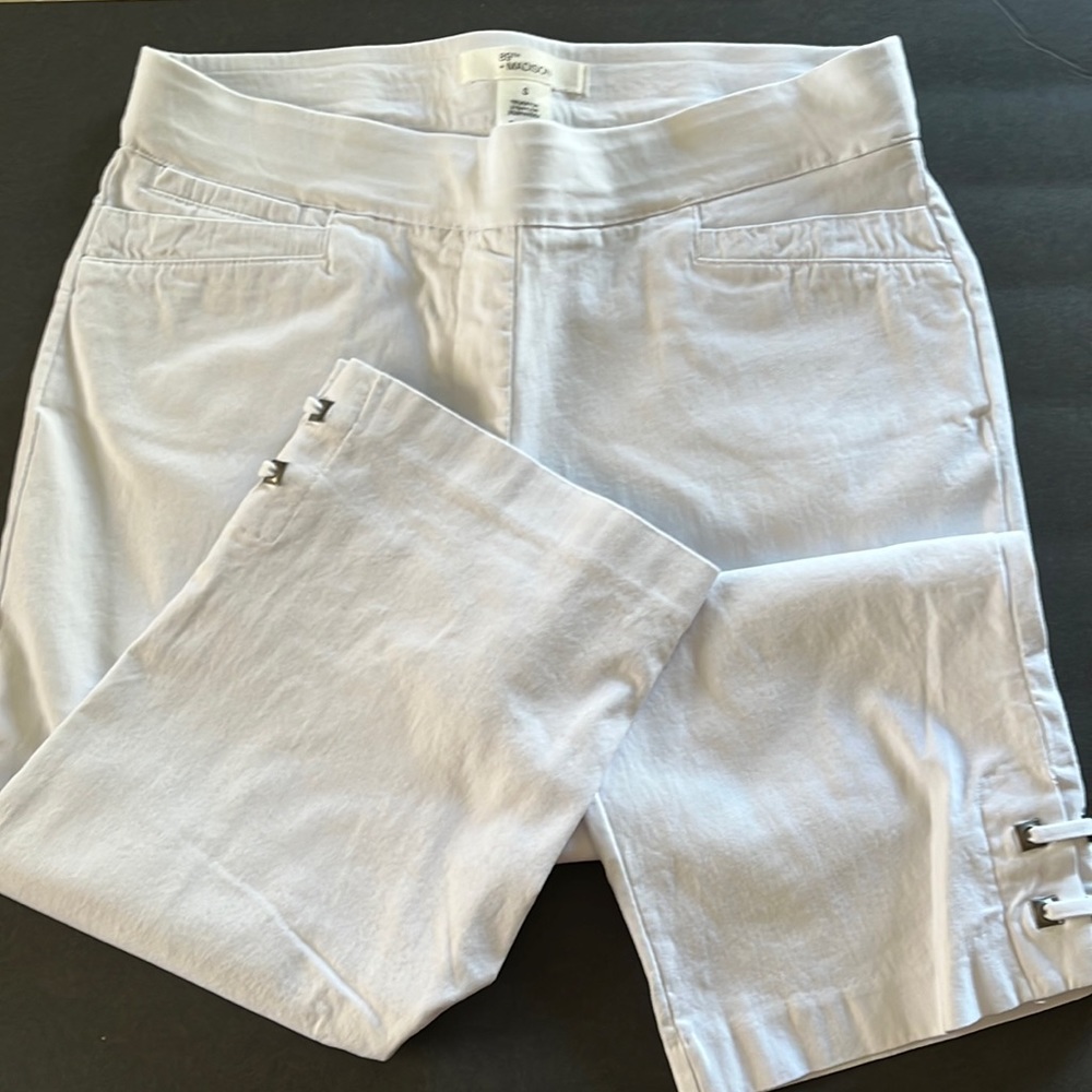 White elastic waist capris with cute metal detail on legs.
